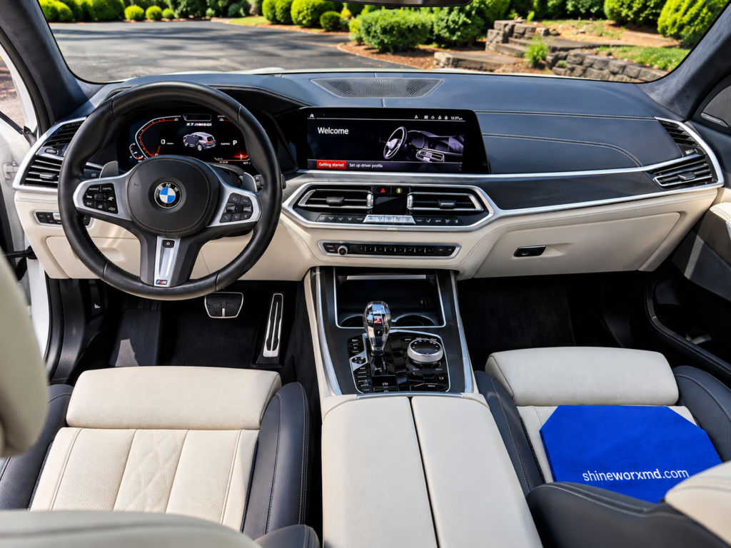 Professionally detailed vehicle interior with clean seats, dashboard and center console