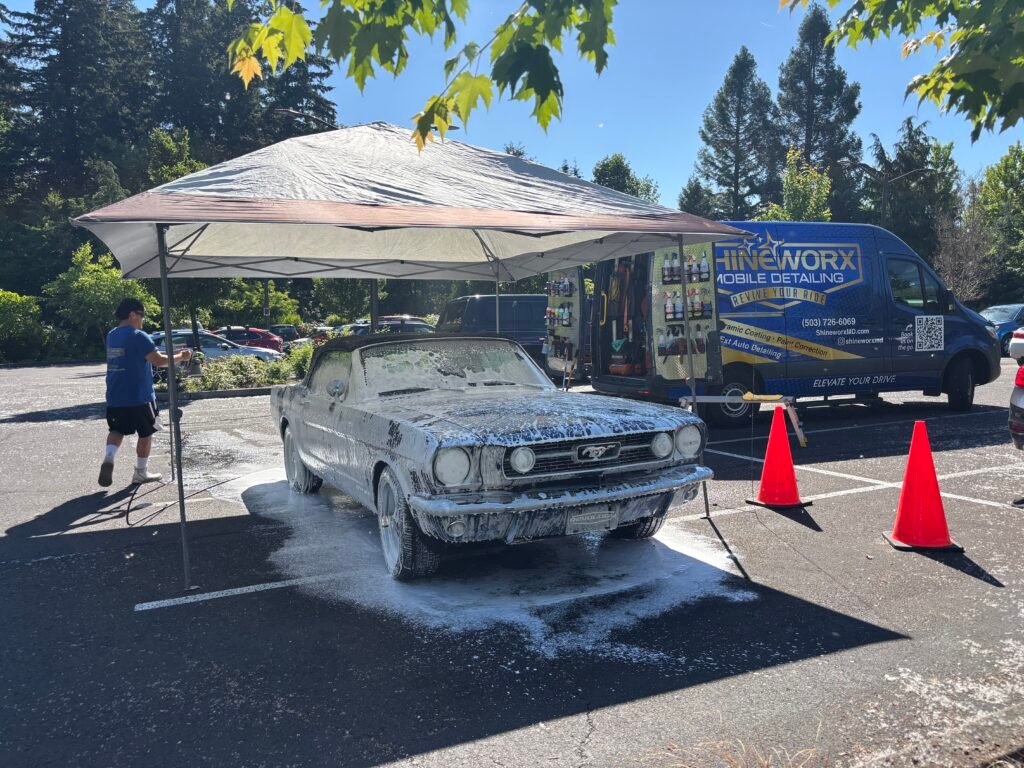 Classic car vehicle receiving a maintenance detail with the Shineworx mobile detailing van on site